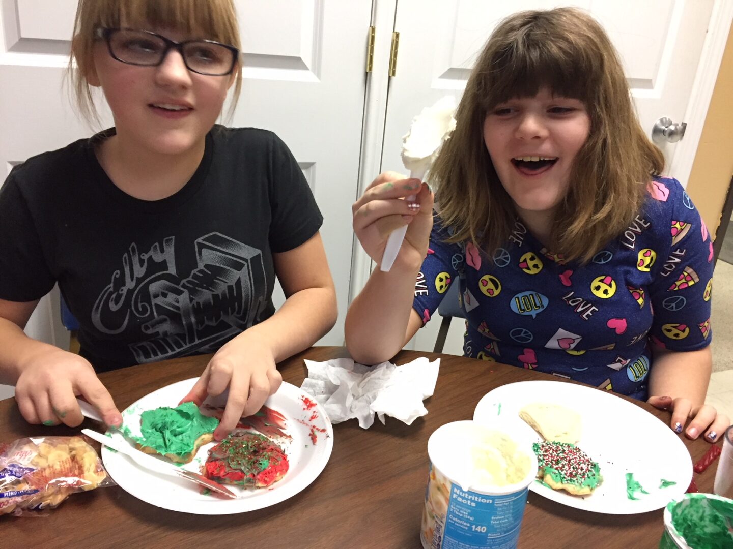 photo of after-school program kids decorating cookies